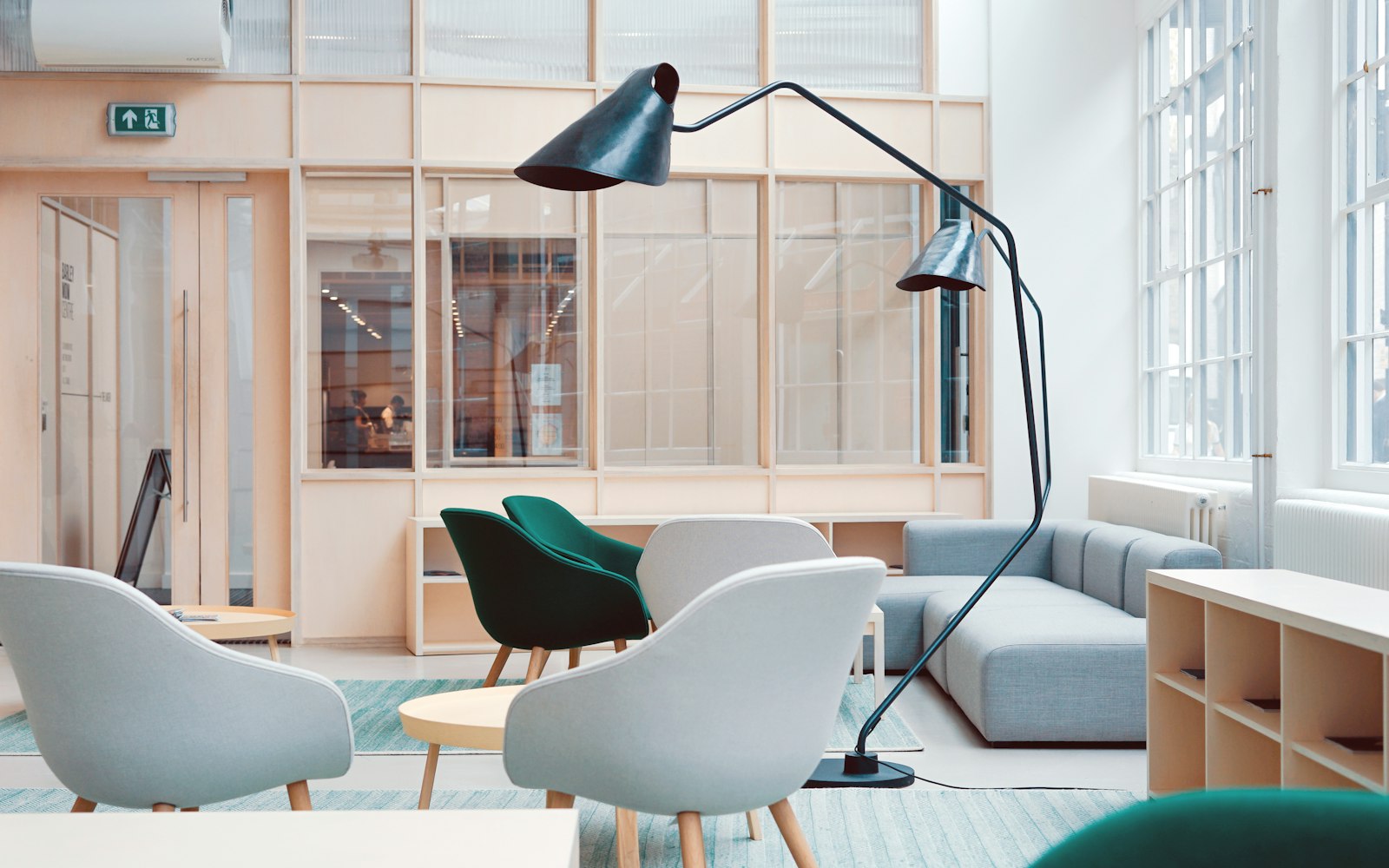 A bright, daylit lobby with lounge seating just inside the main entrance